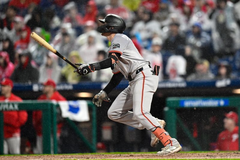 May 4, 2024; Philadelphia, Pennsylvania, USA; San Francisco Giants shortstop Nick Ahmed (16) hits a double against the Philadelphia Phillies during the third inning at Citizens Bank Park. Mandatory Credit: John Jones-USA TODAY Sports