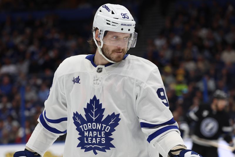 Nov 30, 2024; Tampa, Florida, USA; Toronto Maple Leafs defenseman Oliver Ekman-Larsson (95) looks on against the Tampa Bay Lightning during the second period at Amalie Arena. Mandatory Credit: Kim Klement Neitzel-Imagn Images