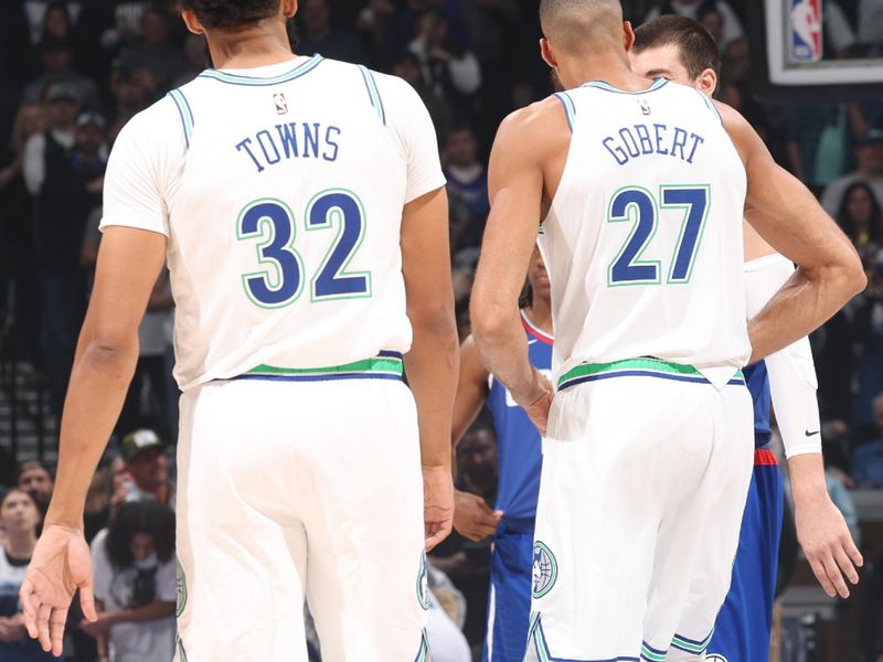 MINNEAPOLIS, MN -  MARCH 3: Karl-Anthony Towns #32 and Rudy Gobert #27 of the Minnesota Timberwolves look on before the game against the LA Clippers on March 3, 2024 at Target Center in Minneapolis, Minnesota. NOTE TO USER: User expressly acknowledges and agrees that, by downloading and or using this Photograph, user is consenting to the terms and conditions of the Getty Images License Agreement. Mandatory Copyright Notice: Copyright 2024 NBAE (Photo by David Sherman/NBAE via Getty Images)