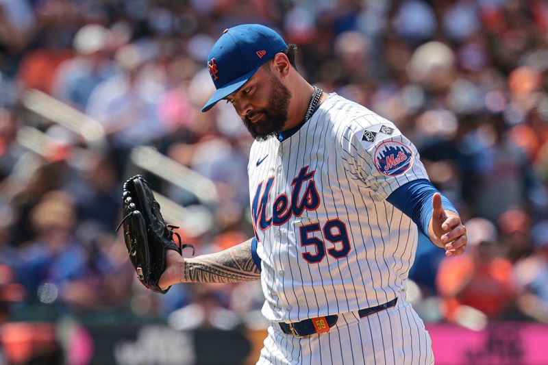 Aug 21, 2024; New York City, New York, USA; New York Mets starting pitcher Sean Manaea (59) reacts after walking off the field after the top of the sixth inning  against the Baltimore Orioles at Citi Field. Mandatory Credit: Vincent Carchietta-USA TODAY Sports