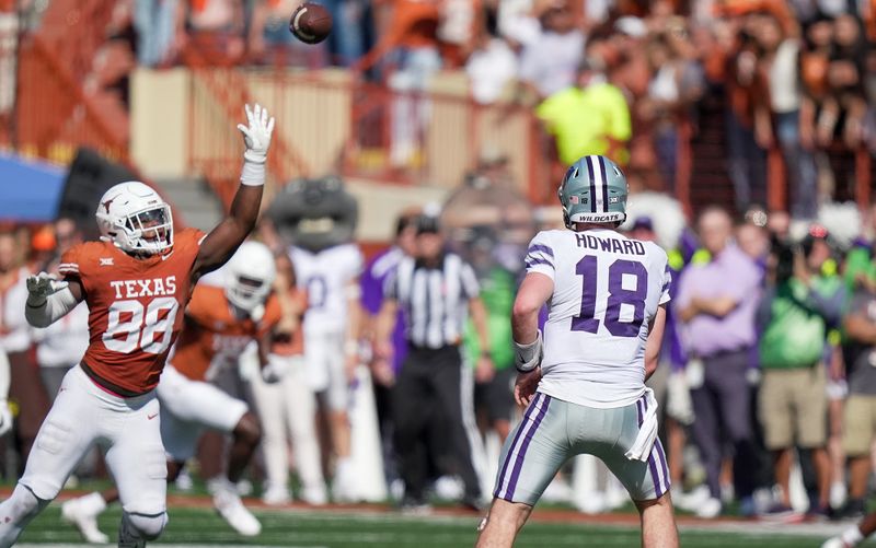 Nov 4, 2023; Austin, Texas, USA; Texas Longhorns defensive end Barryn Sorrell (88) tries to bat the ball out of the air against Kansas State Wildcats quarterback Will Howard (18) in the second half at Darrell K Royal-Texas Memorial Stadium. Mandatory Credit: Ricardo B. Brazziell-USA TODAY Sports