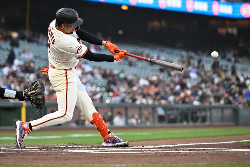 May 1, 2025; San Francisco, California, USA; San Francisco Giants shortstop Willy Adames (2) hits a single against the Colorado Rockies in the first inning at Oracle Park. Mandatory Credit: Eakin Howard-Imagn Images