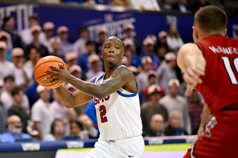 Feb 17, 2026; Dallas, Texas, USA; SMU Mustangs guard Boopie Miller (2) passes the ball over Louisville Cardinals guard Isaac McKneely (10) during the second half at Moody Coliseum. Mandatory Credit: Jerome Miron-Imagn Images