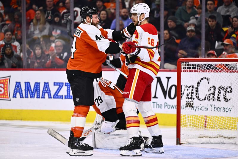 Jan 6, 2024; Philadelphia, Pennsylvania, USA; Philadelphia Flyers left wing Nicolas Deslauriers (44) grabs Calgary Flames left wing A.J. Greer (18) in the first period at Wells Fargo Center. Mandatory Credit: Kyle Ross-USA TODAY Sports