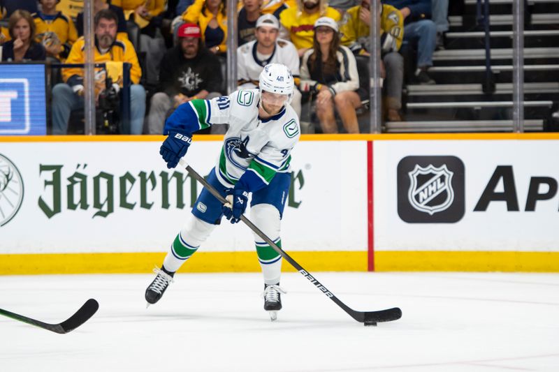 May 3, 2024; Nashville, Tennessee, USA; Vancouver Canucks center Elias Pettersson (40) passes the puck against the Nashville Predator during the first period in game six of the first round of the 2024 Stanley Cup Playoffs at Bridgestone Arena. Mandatory Credit: Steve Roberts-USA TODAY Sports