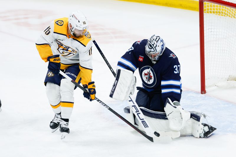 Mar 13, 2024; Winnipeg, Manitoba, CAN; Nashville Predators forward Jason Zucker (16) scores on Winnipeg Jets goalie Connor Hellebuyck (37) during the third period at Canada Life Centre. Mandatory Credit: Terrence Lee-USA TODAY Sports