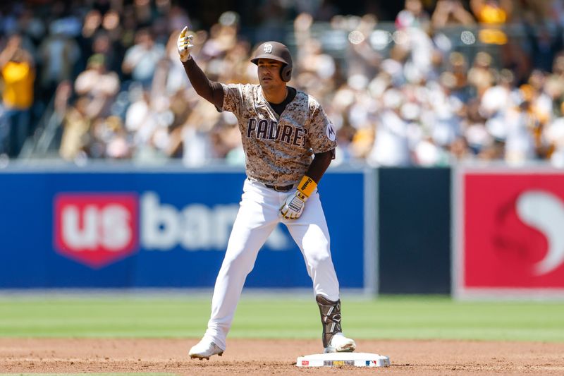 Apr 13, 2025; San Diego, California, USA; San Diego Padres second baseman Jose Iglesias (7) celebrates after hitting a two run double during the first inning against the Colorado Rockies at Petco Park. Mandatory Credit: David Frerker-Imagn Images