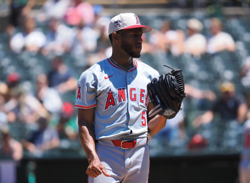 Jul 4, 2024; Oakland, California, USA; Los Angeles Angels starting pitcher Roansy Contreras (57) before being replaced during the third inning against the Oakland Athletics at Oakland-Alameda County Coliseum. Mandatory Credit: Kelley L Cox-USA TODAY Sports