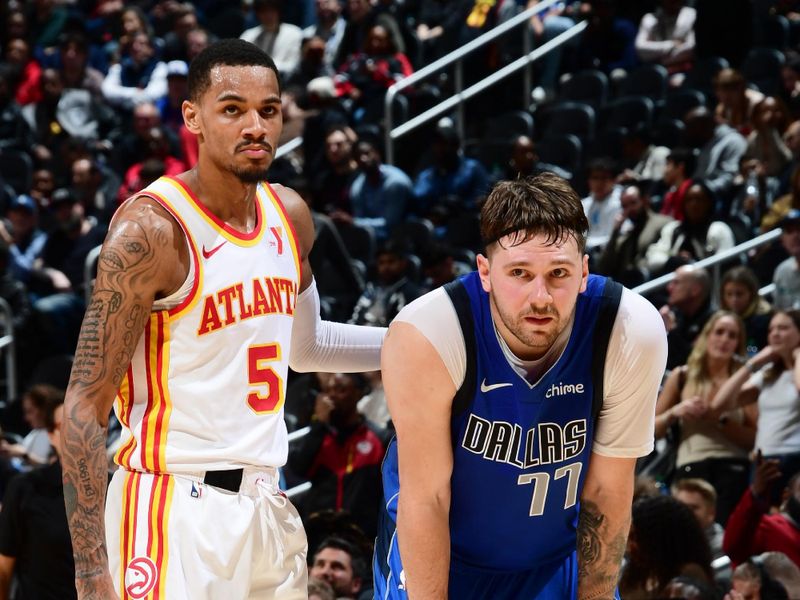 ATLANTA, GA - JANUARY 26: Dejounte Murray #5 of the Atlanta Hawks and Luka Doncic #77 of the Dallas Mavericks look on during the game on January 26, 2024 at State Farm Arena in Atlanta, Georgia.  NOTE TO USER: User expressly acknowledges and agrees that, by downloading and/or using this Photograph, user is consenting to the terms and conditions of the Getty Images License Agreement. Mandatory Copyright Notice: Copyright 2024 NBAE (Photo by Scott Cunningham/NBAE via Getty Images)