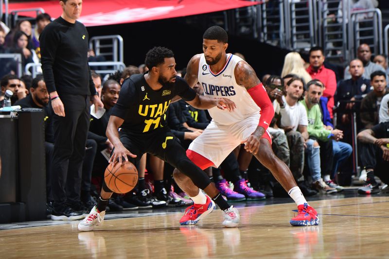 LOS ANGELES, CA - NOVEMBER 6: Mike Conley #11 of the Utah Jazz dribbles the ball during the game against the LA Clippers on November 6, 2022 at Crypto.com Arena in Los Angeles, California. NOTE TO USER: User expressly acknowledges and agrees that, by downloading and/or using this Photograph, user is consenting to the terms and conditions of the Getty Images License Agreement. Mandatory Copyright Notice: Copyright 2022 NBAE (Photo by Adam Pantozzi/NBAE via Getty Images)