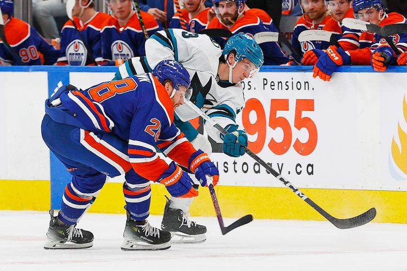 Apr 15, 2024; Edmonton, Alberta, CAN; San Jose Sharks defensemen Henry Thrun (3) and Edmonton Oilers forward Connor Brown (28) battle for a loose puck during the second period at Rogers Place. Mandatory Credit: Perry Nelson-USA TODAY Sports