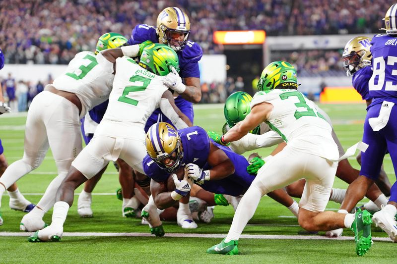 Dec 1, 2023; Las Vegas, NV, USA; Washington Huskies running back Dillon Johnson (7) scores a touchdown against the Oregon Ducks during the fourth quarter at Allegiant Stadium. Mandatory Credit: Stephen R. Sylvanie-USA TODAY Sports