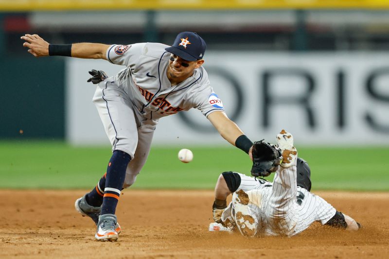 May 13, 2023; Chicago, Illinois, USA; Chicago White Sox left fielder Andrew Benintendi (23) steals second base against Houston Astros second baseman Mauricio Dubon (14) during the seventh inning at Guaranteed Rate Field. Mandatory Credit: Kamil Krzaczynski-USA TODAY Sports