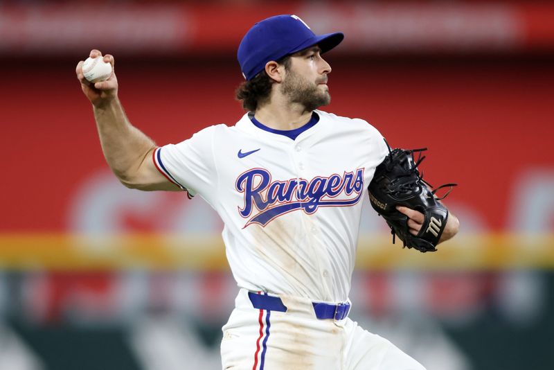 May 14, 2025; Arlington, Texas, USA; Texas Rangers shortstop Josh Smith (8) throws the ball to first base during the eighth inning against the Colorado Rockies at Globe Life Field. Mandatory Credit: Tim Heitman-Imagn Images