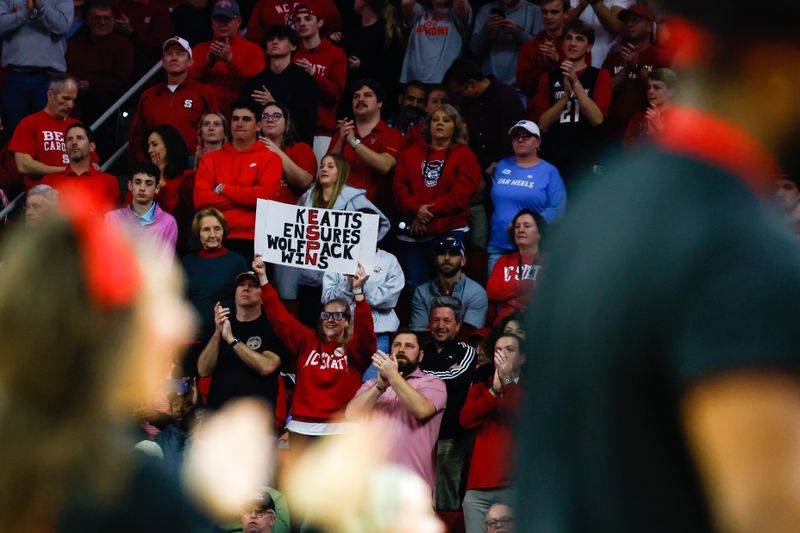 Feb 19, 2023; Raleigh, North Carolina, USA;  North Carolina State Wolfpack fan sign seen during the second half of the game against North Carolina Tar Heels at PNC Arena. Mandatory Credit: Jaylynn Nash-USA TODAY Sports