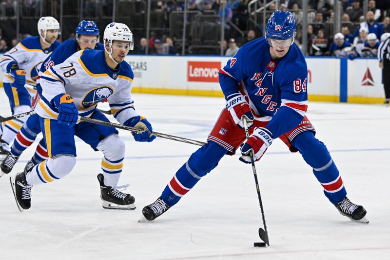 Nov 7, 2024; New York, New York, USA;  New York Rangers center Adam Edstrom (84) skates with the puck against Buffalo Sabres defenseman Jacob Bryson (78) during the second period at Madison Square Garden. Mandatory Credit: Dennis Schneidler-Imagn Images