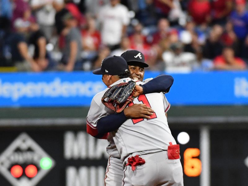 Sep 13, 2023; Philadelphia, Pennsylvania, USA; Atlanta Braves shortstop Orlando Arcia (11) and second baseman Ozzie Albies (1) celebrate their 6th straight National League East title with win against the Philadelphia Phillies at Citizens Bank Park.  Mandatory Credit: Eric Hartline-USA TODAY Sports