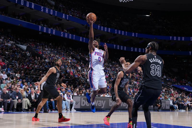 PHILADELPHIA, PA - APRIL 14: Tyrese Maxey #0 of the Philadelphia 76ers shoots the ball during the game against the Brooklyn Nets on April 14, 2024 at the Wells Fargo Center in Philadelphia, Pennsylvania NOTE TO USER: User expressly acknowledges and agrees that, by downloading and/or using this Photograph, user is consenting to the terms and conditions of the Getty Images License Agreement. Mandatory Copyright Notice: Copyright 2024 NBAE (Photo by Jesse D. Garrabrant/NBAE via Getty Images)