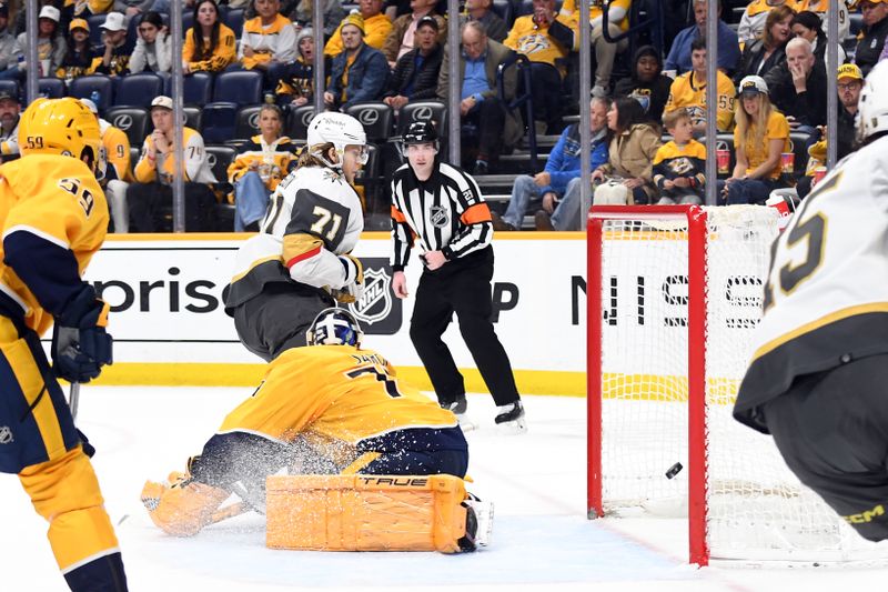 Mar 26, 2024; Nashville, Tennessee, USA; Vegas Golden Knights center William Karlsson (71) scores against Nashville Predators goaltender Juuse Saros (74) during the second period at Bridgestone Arena. Mandatory Credit: Christopher Hanewinckel-USA TODAY Sports