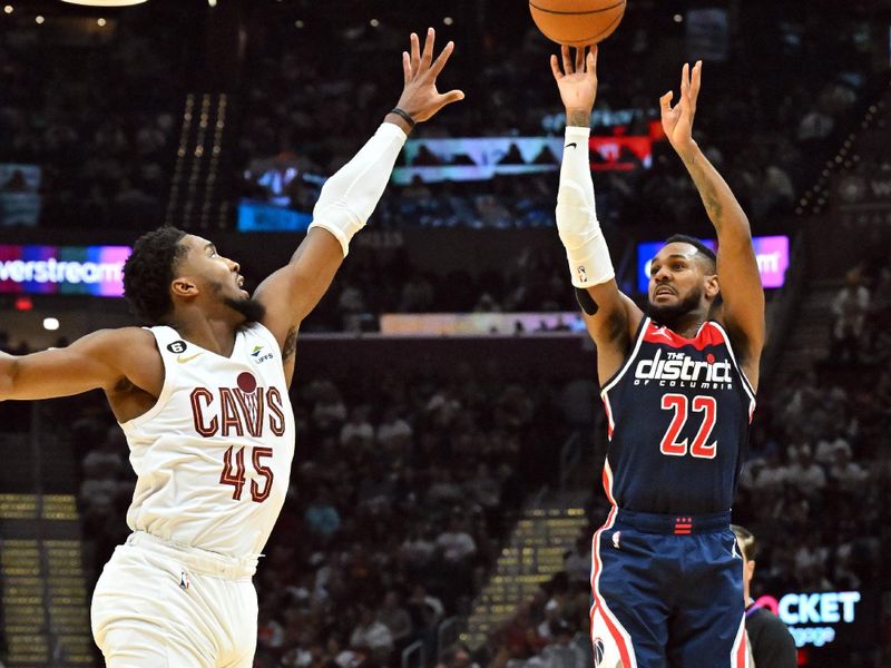 CLEVELAND, OHIO - OCTOBER 23: Monte Morris #22 of the Washington Wizards shoots over Donovan Mitchell #45 of the Cleveland Cavaliers during the third quarter at Rocket Mortgage Fieldhouse on October 23, 2022 in Cleveland, Ohio. The Cavaliers defeated the Wizards 117-107 in overtime. NOTE TO USER: User expressly acknowledges and agrees that, by downloading and or using this photograph, User is consenting to the terms and conditions of the Getty Images License Agreement. (Photo by Jason Miller/Getty Images)