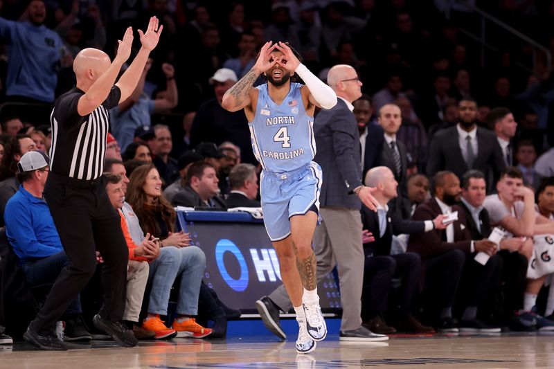 Dec 5, 2023; New York, New York, USA; North Carolina Tar Heels guard RJ Davis (4) celebrates his three point shot against the Connecticut Huskies during the first half at Madison Square Garden. Mandatory Credit: Brad Penner-USA TODAY Sports