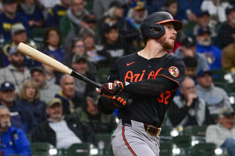 May 21, 2025; Milwaukee, Wisconsin, USA; Baltimore Orioles first baseman Ryan O'Hearn (32) drives in a run with a base hit in the fourth inning against the Milwaukee Brewers at American Family Field. Mandatory Credit: Benny Sieu-Imagn Images