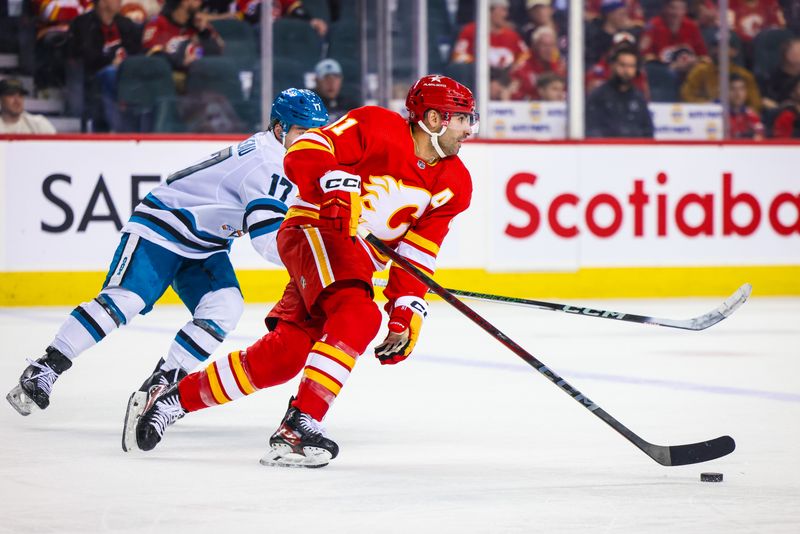 Apr 18, 2024; Calgary, Alberta, CAN; Calgary Flames center Nazem Kadri (91) skates with the puck against the San Jose Sharks during the third period at Scotiabank Saddledome. Mandatory Credit: Sergei Belski-USA TODAY Sports