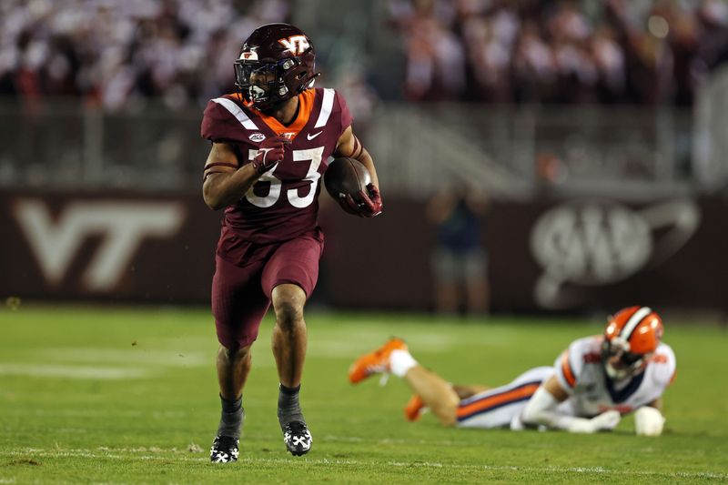 Oct 26, 2023; Blacksburg, Virginia, USA; Virginia Tech Hokies running back Bhayshul Tuten (33) runs the ball against Syracuse Orange defensive back Justin Barron (8) during the fourth quarter at Lane Stadium. Mandatory Credit: Peter Casey-USA TODAY Sports