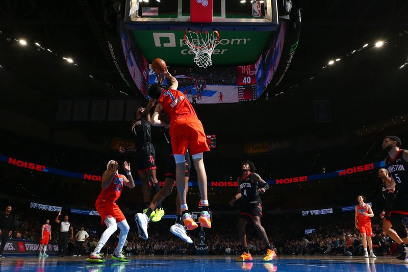 OKLAHOMA CITY, OK - MARCH 27:  Amen Thompson #1 of the Houston Rockets grabs a rebound during the game against the Oklahoma City Thunder on March 27, 2024 at Paycom Arena in Oklahoma City, Oklahoma. NOTE TO USER: User expressly acknowledges and agrees that, by downloading and or using this photograph, User is consenting to the terms and conditions of the Getty Images License Agreement. Mandatory Copyright Notice: Copyright 2024 NBAE (Photo by Zach Beeker/NBAE via Getty Images)