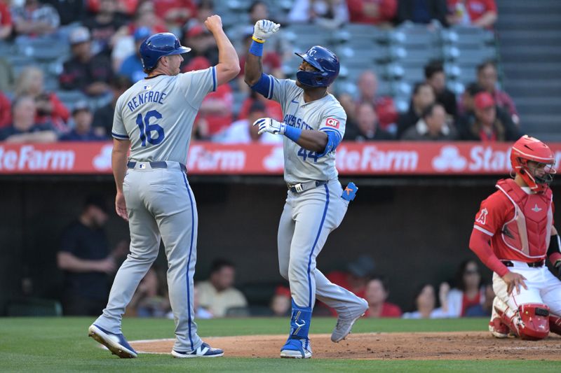 May 9, 2024; Anaheim, California, USA;  Kansas City Royals outfielder Dairon Blanco (44) is congratulated by third base coach Vance Wilson (25) after hitting a two-run home run off Los Angeles Angels pitcher Reid Detmers (48) in the third inning at Angel Stadium. Mandatory Credit: Jayne Kamin-Oncea-USA TODAY Sports