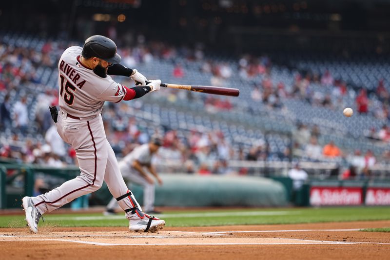 Jun 7, 2023; Washington, District of Columbia, USA; Arizona Diamondbacks third baseman Emmanuel Rivera (15) hits a 2 RBI double against the Washington Nationals  during the first inning at Nationals Park. Mandatory Credit: Scott Taetsch-USA TODAY Sports