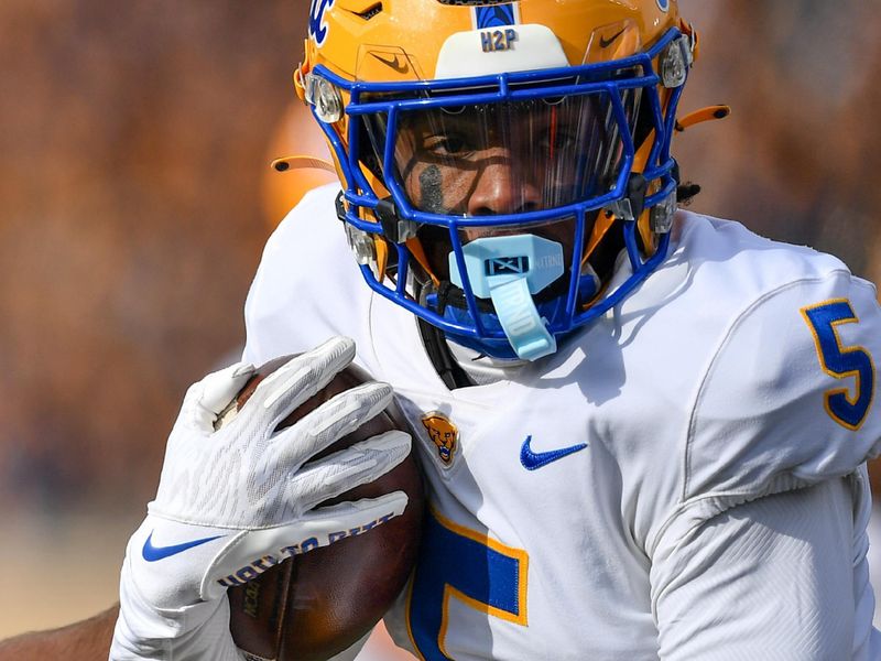 Oct 28, 2023; South Bend, Indiana, USA; Pittsburgh Panthers safety Phillip O'Brien Jr. (5) runs the ball after an interception in the first quarter against the Notre Dame Fighting Irish at Notre Dame Stadium. Mandatory Credit: Matt Cashore-USA TODAY Sports