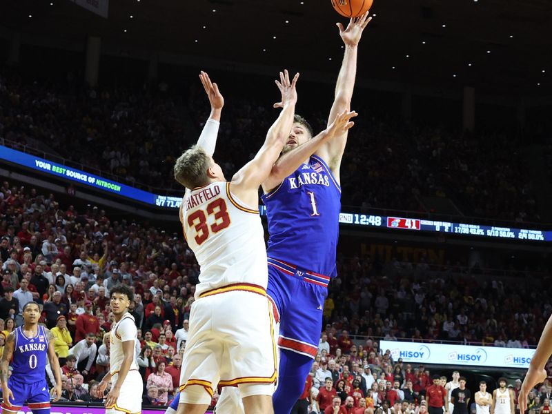 Jan 15, 2025; Ames, Iowa, USA; Iowa State Cyclones forward Brandton Chatfield (33) defends the shot from Iowa State Cyclones during the second half at James H. Hilton Coliseum. Mandatory Credit: Reese Strickland-Imagn Images