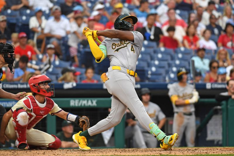 Jul 14, 2024; Philadelphia, Pennsylvania, USA; Oakland Athletics outfielder Lawrence Butler (4) hits his third home run of the game against the Philadelphia Phillies during the seventh inning at Citizens Bank Park. Mandatory Credit: Eric Hartline-USA TODAY Sports