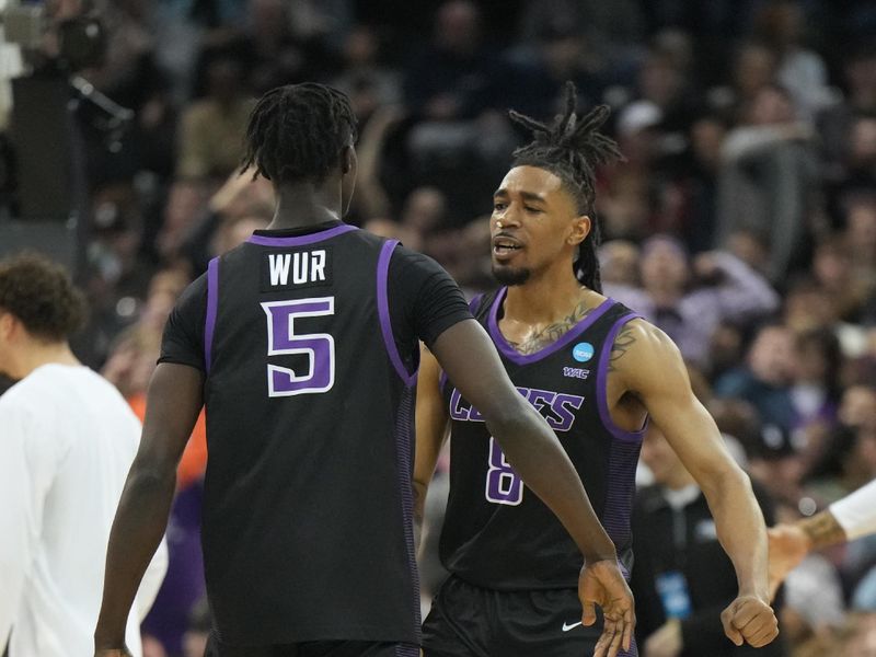 Mar 24, 2024; Spokane, WA, USA; Grand Canyon Antelopes forward Lok Wur (5) celebrates with guard Collin Moore (8) in the first half at Spokane Veterans Memorial Arena. Mandatory Credit: Kirby Lee-USA TODAY Sports