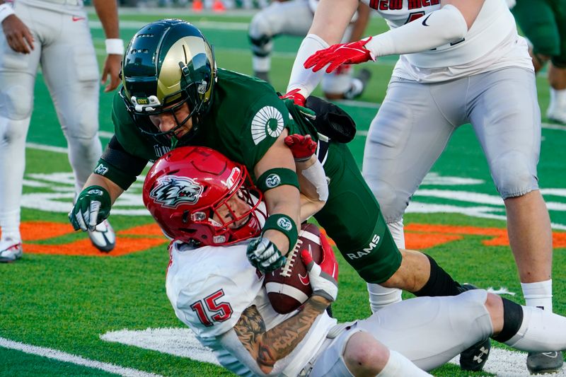 Nov 25, 2022; Fort Collins, Colorado, USA; Colorado State Rams defensive back Ayden Hector (32) tackles New Mexico Lobos wide receiver Luke Wysong (15) for no gain after a pass reception  at Sonny Lubick Field at Canvas Stadium. Mandatory Credit: Michael Madrid-USA TODAY Sports