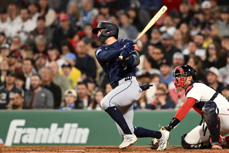Apr 23, 2025; Boston, Massachusetts, USA; Seattle Mariners third base Ben Williamson (9) hits a RBI single against the Boston Red Sox during the seventh inning at Fenway Park. Mandatory Credit: Brian Fluharty-Imagn Images