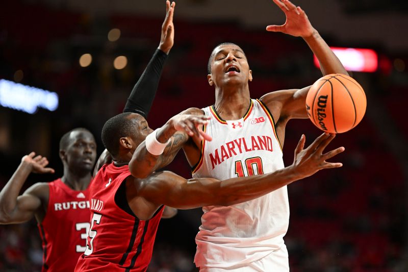 Feb 6, 2024; College Park, Maryland, USA; Maryland Terrapins forward Julian Reese (10) reacts after making contact with Rutgers Scarlet Knights forward Aundre Hyatt (5)  during the second half  at Xfinity Center. Mandatory Credit: Tommy Gilligan-USA TODAY Sports