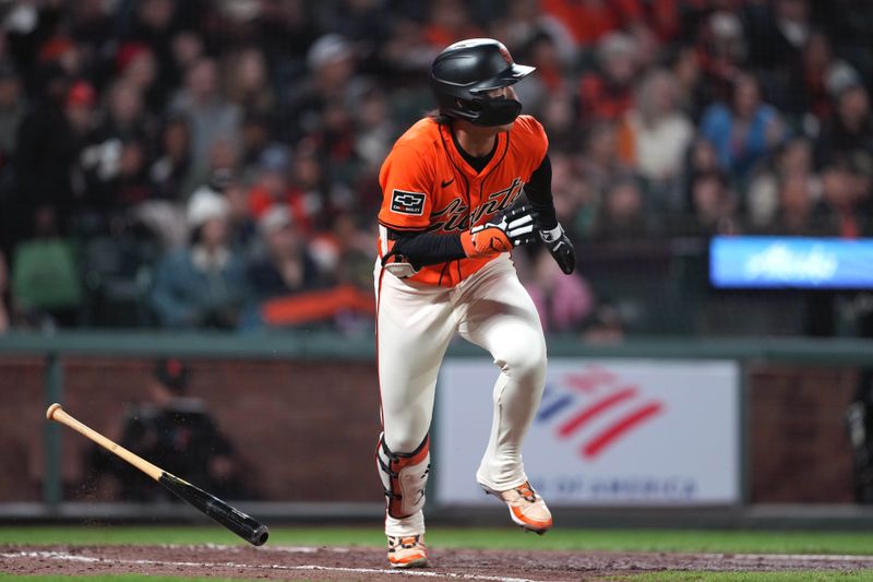 Apr 26, 2024; San Francisco, California, USA; San Francisco Giants outfielder Jung Hoo Lee (51) hits a single against the Pittsburgh Pirates during the sixth inning at Oracle Park. Mandatory Credit: Darren Yamashita-USA TODAY Sports