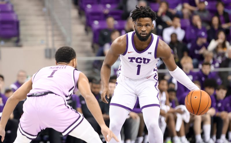 Jan 14, 2023; Fort Worth, Texas, USA;  TCU Horned Frogs guard Mike Miles Jr. (1) dribbles as Kansas State Wildcats guard Markquis Nowell (1) defends during the first half at Ed and Rae Schollmaier Arena. Mandatory Credit: Kevin Jairaj-USA TODAY Sports