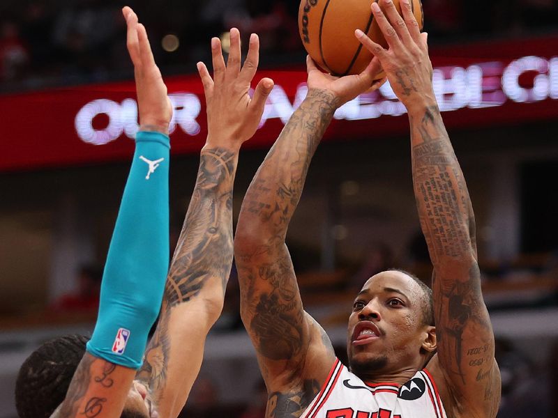 CHICAGO, ILLINOIS - DECEMBER 06: DeMar DeRozan #11 of the Chicago Bulls shoots over Miles Bridges #0 of the Charlotte Hornets during the first half at the United Center on December 06, 2023 in Chicago, Illinois. NOTE TO USER: User expressly acknowledges and agrees that, by downloading and or using this photograph, User is consenting to the terms and conditions of the Getty Images License Agreement.  (Photo by Michael Reaves/Getty Images)