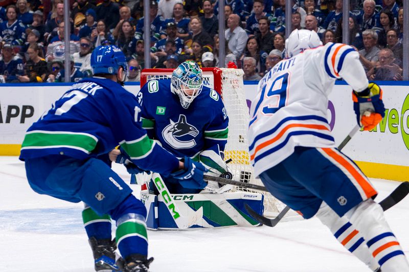 May 10, 2024; Vancouver, British Columbia, CAN; Vancouver Canucks goalie Arturs Silvos (31) makes a save on Edmonton Oilers forward Leon Draisaitl (29) during the second period in game two of the second round of the 2024 Stanley Cup Playoffs at Rogers Arena. Mandatory Credit: Bob Frid-USA TODAY Sports