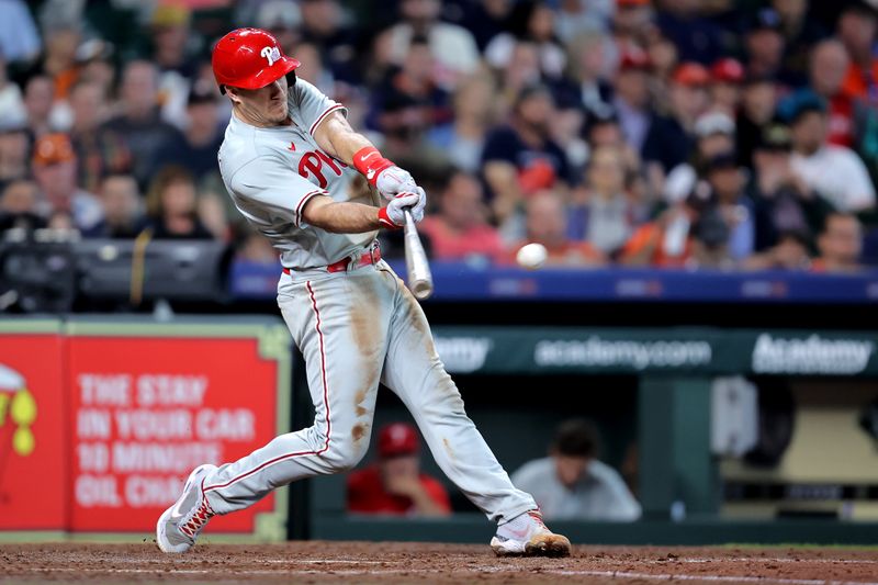 Apr 29, 2023; Houston, Texas, USA; Philadelphia Phillies catcher J.T. Realmuto (10) hits a single against the Houston Astros during the sixth inning at Minute Maid Park. Mandatory Credit: Erik Williams-USA TODAY Sports