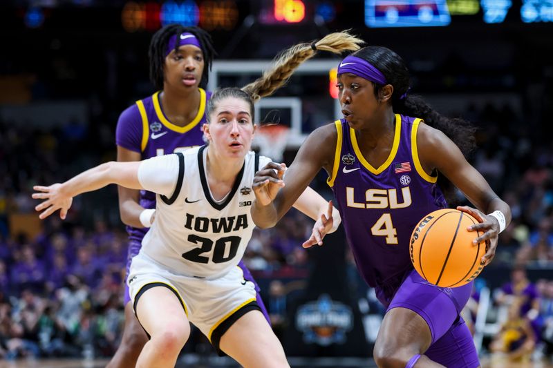 Apr 2, 2023; Dallas, TX, USA; LSU Lady Tigers guard Flau'jae Johnson (4) drives to the basket against Iowa Hawkeyes guard Kate Martin (20) in the first half during the final round of the Women's Final Four NCAA tournament at the American Airlines Center. Mandatory Credit: Kevin Jairaj-USA TODAY Sports