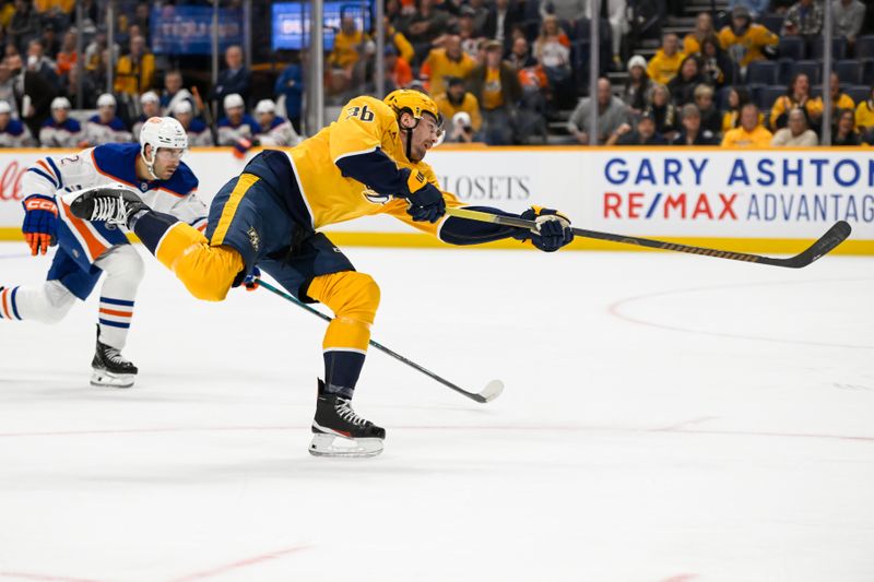 Oct 17, 2024; Nashville, Tennessee, USA;  Nashville Predators left wing Cole Smith (36) takes a shot on goal against the Edmonton Oilers during the first period at Bridgestone Arena. Mandatory Credit: Steve Roberts-Imagn Images