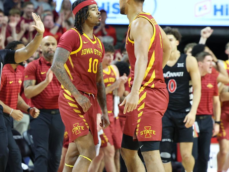 Feb 15, 2025; Ames, Iowa, USA; Iowa State Cyclones forward Joshua Jefferson (2) and Iowa State Cyclones guard Keshon Gilbert (10) celebrate during the second half at James H. Hilton Coliseum. Mandatory Credit: Reese Strickland-Imagn Images