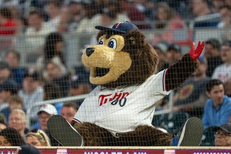 May 15, 2024; Minneapolis, Minnesota, USA; Minnesota Twins mascot T.C. Bear engages with fans in the game against the New York Yankees at Target Field. Mandatory Credit: Matt Blewett-USA TODAY Sports