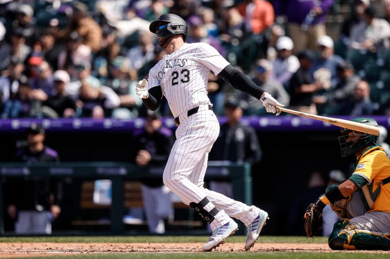 Apr 6, 2025; Denver, Colorado, USA; Colorado Rockies designated hitter Kris Bryant (23) hits a double in the third inning against the Athletics at Coors Field. Mandatory Credit: Isaiah J. Downing-Imagn Images