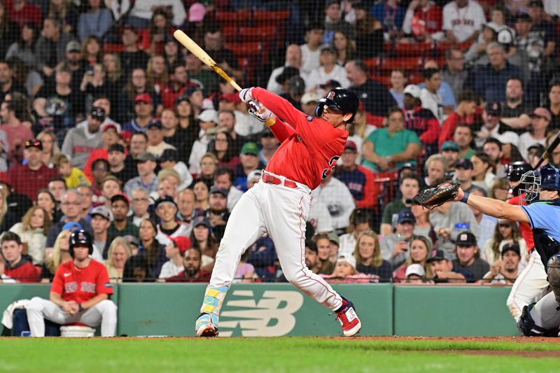 Sep 27, 2024; Boston, Massachusetts, USA; Boston Red Sox first baseman Triston Casas (36) hits a single against the Tampa Bay Rays during fourth inning at Fenway Park. Mandatory Credit: Eric Canha-Imagn Images