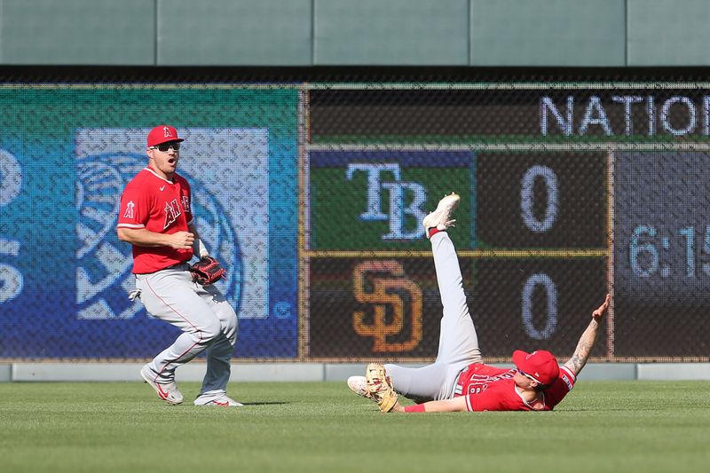 Jun 17, 2023; Kansas City, Missouri, USA; Los Angeles Angels right fielder Mickey Moniak (16) makes a diving catch during the seventh inning against the Kansas City Royals at Kauffman Stadium. Mandatory Credit: Scott Sewell-USA TODAY Sports